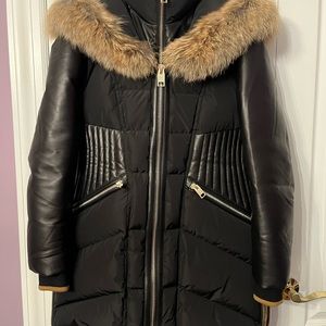 Series by Nicole Benisti black coat or jacket with fox fur.  It is size Large.
